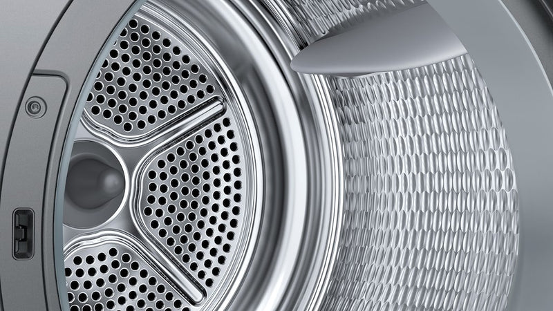 Close-up of a dryer drum with metallic finish